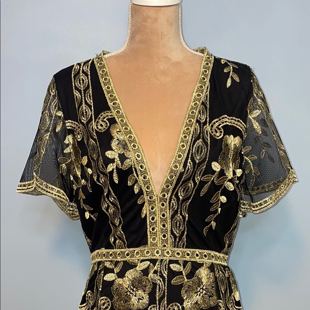 Elegant Black and Gold Romper with Modern Flair Size Medium - Picture 2 of 12